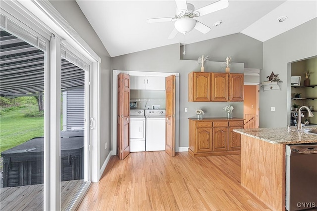 3616 E Genesee St Rd, Sennett, NY 13021 - kitchen featuring vaulted ceiling, light wood-style flooring, separate washer and dryer, a ceiling fan, and light stone counters
