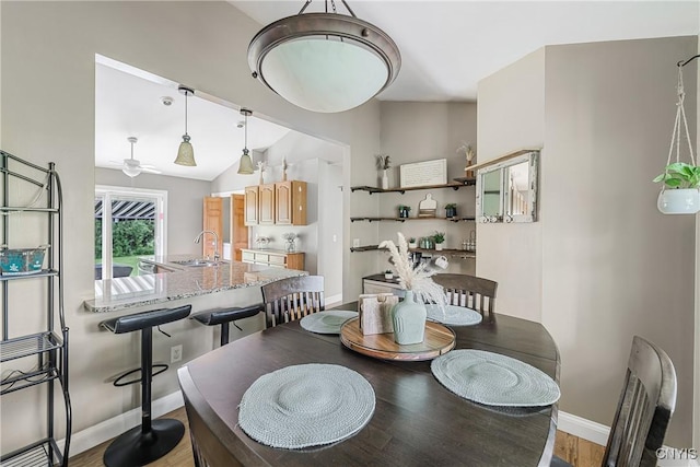 3616 E Genesee St Rd, Sennett, NY 13021 - dining space with baseboards, light wood-type flooring, a ceiling fan, and vaulted ceiling