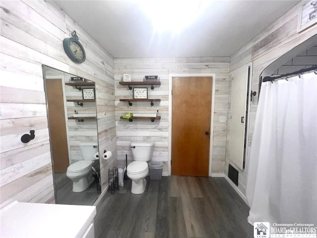 3108 N Main Street Ext, Ellicott, NY 14701 - bathroom with toilet, wood finished floors, wood walls, and a shower with shower curtain