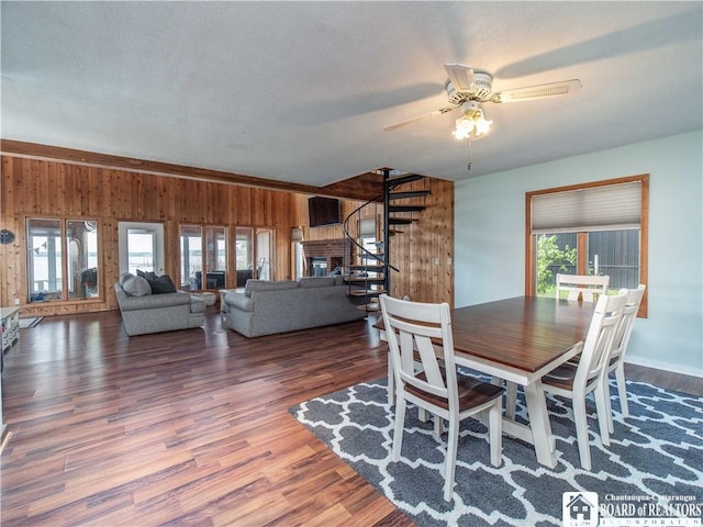 3973 Rte 430, Ellery, NY 14712 - dining area featuring wood walls, healthy amount of natural light, ceiling fan, and stairway