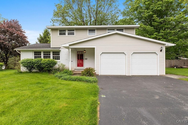 4155 Old Winding Way, Onondaga, NY 13215 - view of front of house featuring asphalt driveway and a garage