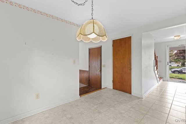 4155 Old Winding Way, Onondaga, NY 13215 - spare room featuring baseboards, stairs, and light tile patterned floors