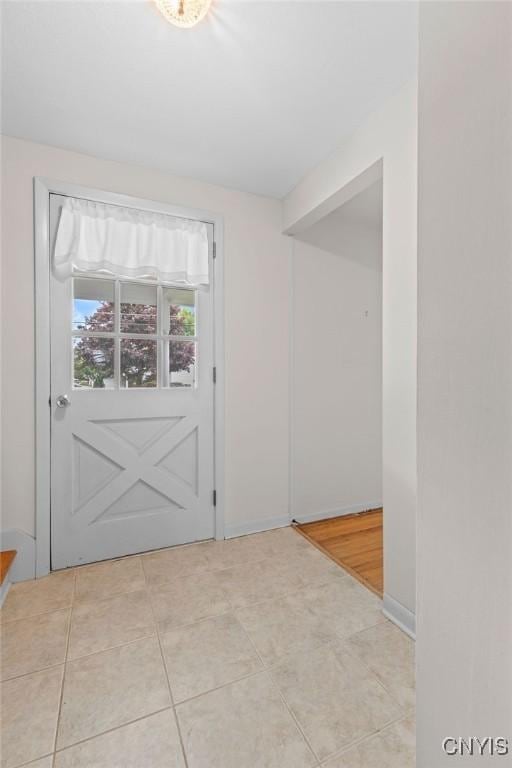 4155 Old Winding Way, Onondaga, NY 13215 - entryway featuring tile patterned floors and baseboards
