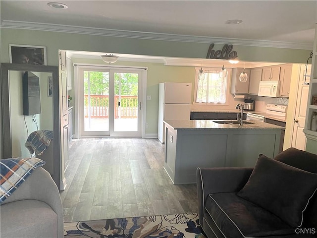 76 Windebank Ln, Manlius, NY 13116 - kitchen featuring white appliances, a sink, light wood finished floors, an island with sink, and ornamental molding