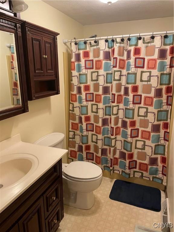 76 Windebank Ln, Manlius, NY 13116 - bathroom featuring toilet, vanity, a shower with curtain, and tile patterned floors