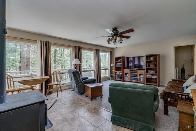 7678 N Shore Rd, Watson, NY 13343 - living room featuring ceiling fan and light tile patterned floors