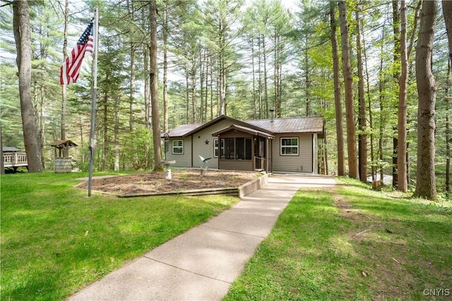 7678 N Shore Rd, Watson, NY 13343 - view of front of property featuring a front yard and metal roof