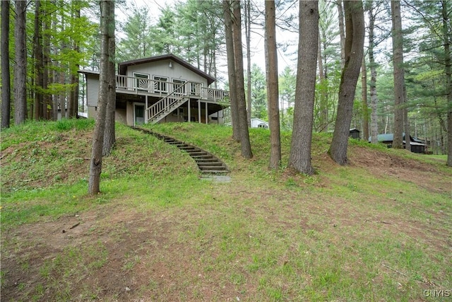 7678 N Shore Rd, Watson, NY 13343 - view of front of home featuring a wooden deck and stairway
