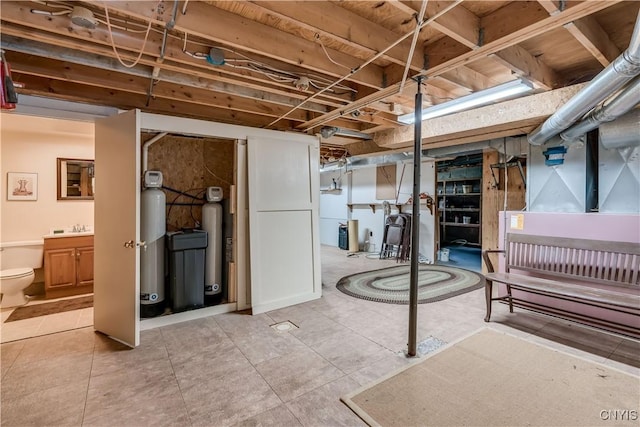 7678 N Shore Rd, Watson, NY 13343 - unfinished basement featuring light tile patterned floors and a sink