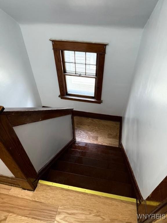 staircase featuring baseboards