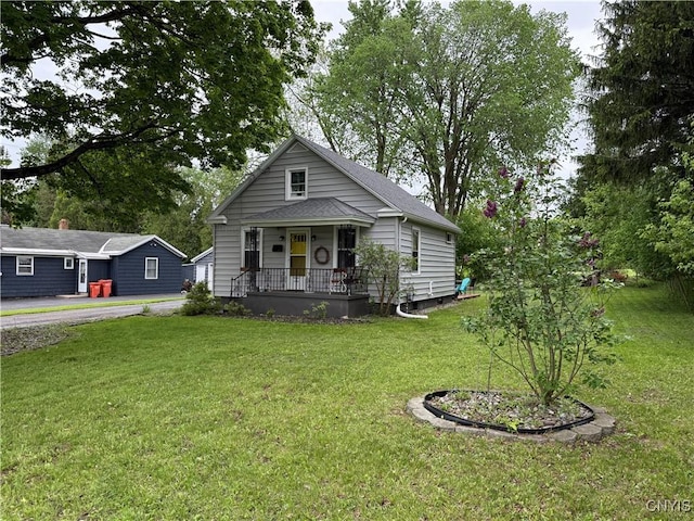 41 Young Ave, New Hartford, NY 13417 - view of front of property featuring a porch, a front yard, and a shingled roof