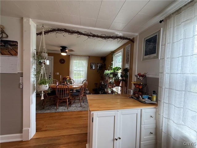 41 Young Ave, New Hartford, NY 13417 - kitchen with white cabinetry, light wood finished floors, wood counters, and a ceiling fan