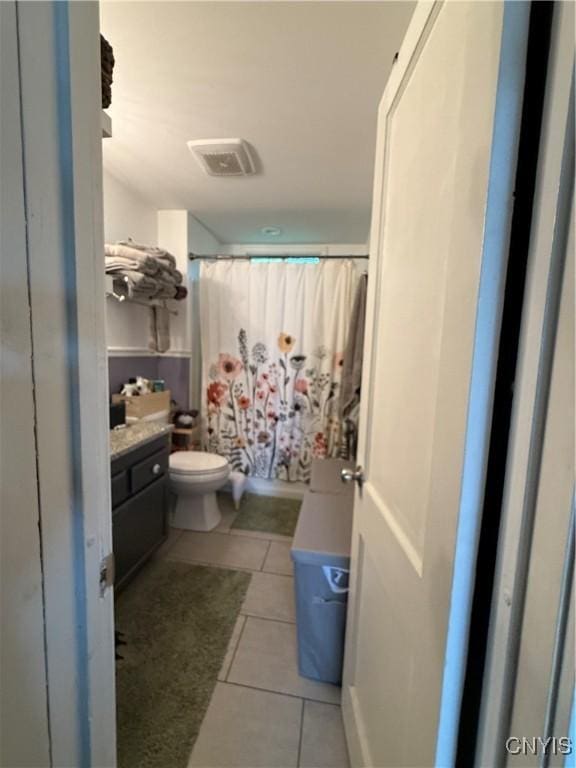 41 Young Ave, New Hartford, NY 13417 - bathroom with tile patterned flooring, toilet, vanity, and curtained shower