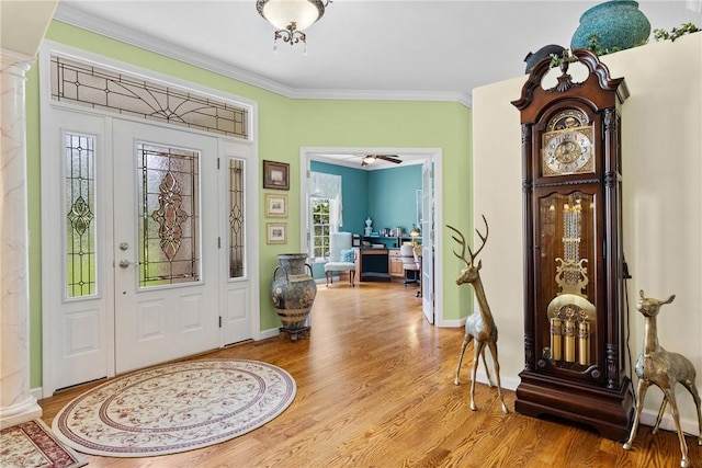 1619 Five Mile Ln Rd, Penfield, NY 14526 - entryway with light wood-style floors, ornamental molding, ornate columns, and baseboards
