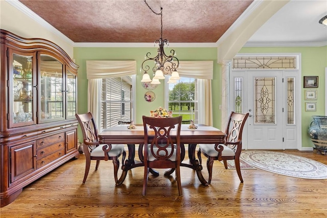 1619 Five Mile Ln Rd, Penfield, NY 14526 - dining room with a chandelier, light wood finished floors, and crown molding