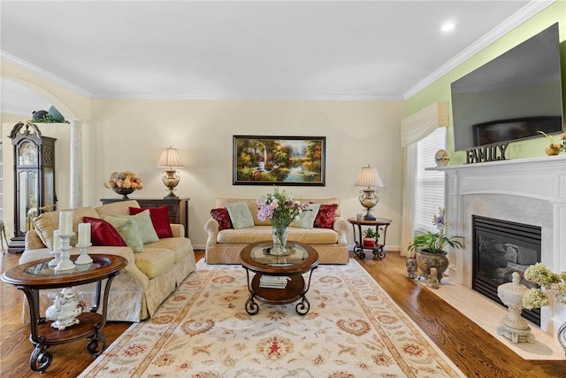 1619 Five Mile Ln Rd, Penfield, NY 14526 - living area with wood finished floors, a fireplace, ornamental molding, baseboards, and decorative columns