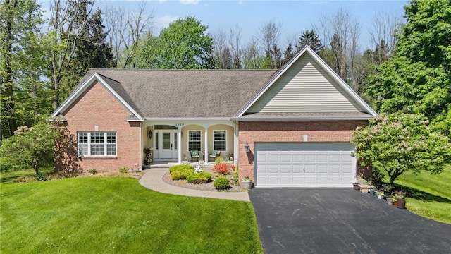 1619 Five Mile Ln Rd, Penfield, NY 14526 - view of front of home featuring brick siding, a front yard, an attached garage, and driveway