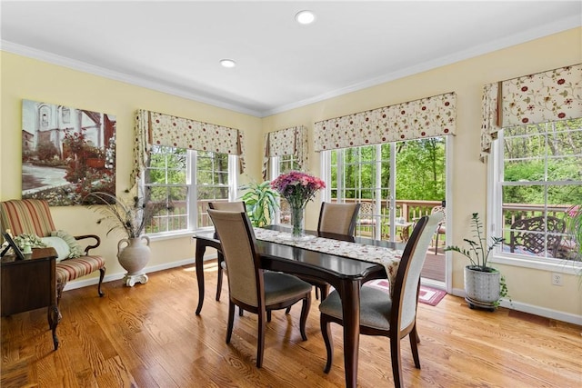 1619 Five Mile Ln Rd, Penfield, NY 14526 - dining space featuring crown molding, baseboards, wood finished floors, and recessed lighting
