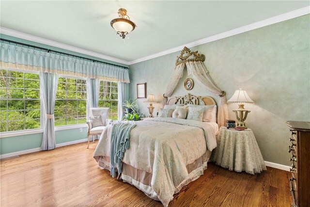 1619 Five Mile Ln Rd, Penfield, NY 14526 - bedroom with baseboards, wood finished floors, and crown molding