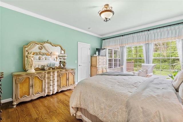 1619 Five Mile Ln Rd, Penfield, NY 14526 - bedroom with wood finished floors, multiple windows, ornamental molding, and baseboards