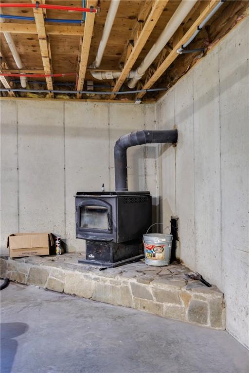 2208 Davis Rd, Corning, NY 14830 - detailed view of a wood stove and concrete flooring