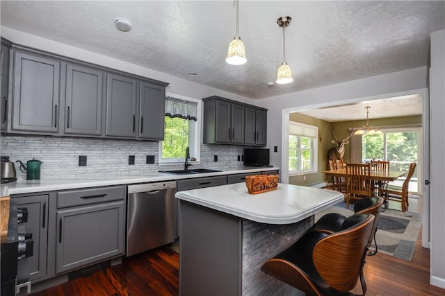 2208 Davis Rd, Corning, NY 14830 - kitchen with a sink, stainless steel dishwasher, dark wood finished floors, backsplash, and gray cabinets