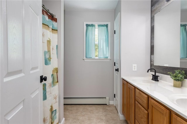 2208 Davis Rd, Corning, NY 14830 - full bath featuring a baseboard radiator, double vanity, and baseboards