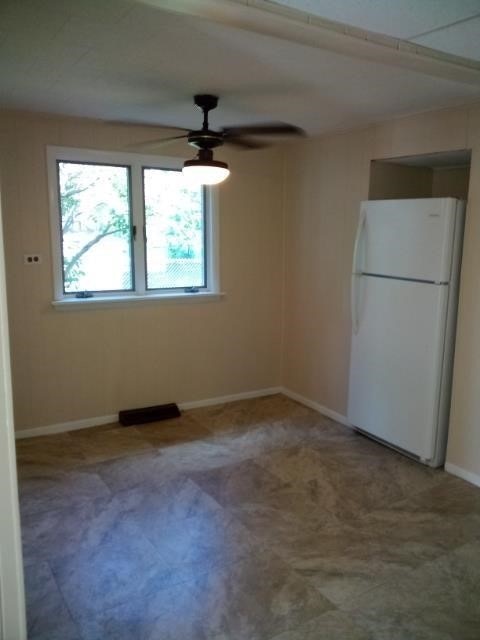 404 Perry St, Horseheads, NY 14845 - carpeted empty room with ceiling fan and baseboards