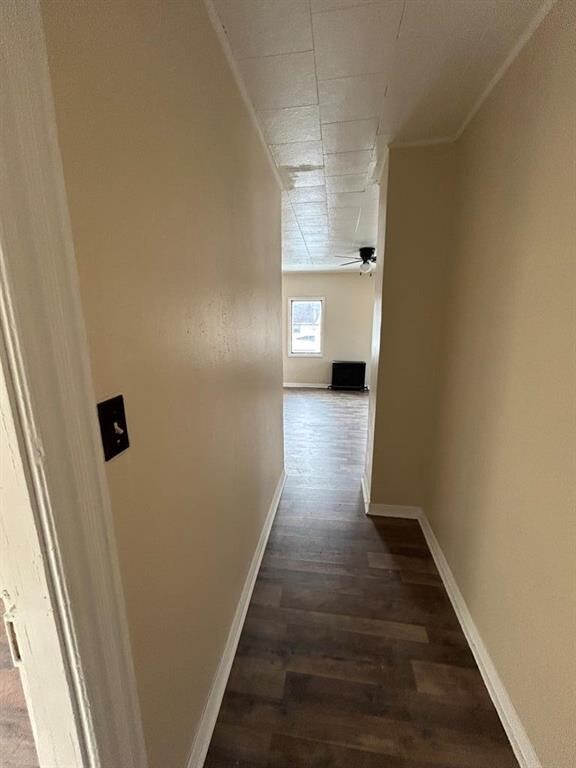 232 Birchwood Ave, Horseheads, NY 14903 - hallway featuring baseboards, dark wood-type flooring, and crown molding