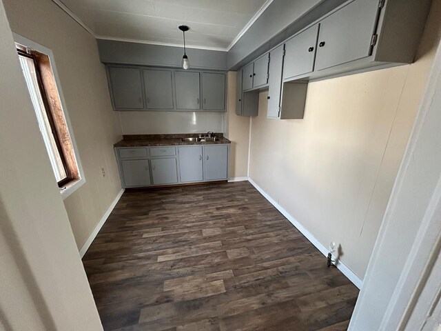 232 Birchwood Ave, Horseheads, NY 14903 - kitchen with dark wood finished floors, a sink, crown molding, and baseboards