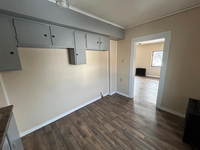 232 Birchwood Ave, Horseheads, NY 14903 - unfurnished dining area featuring dark wood finished floors, crown molding, and baseboards