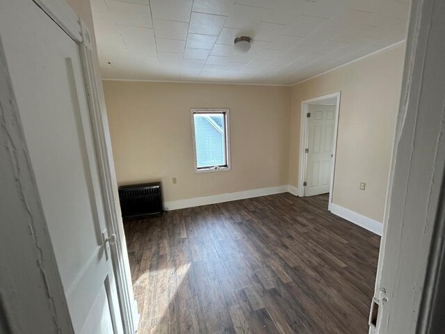 232 Birchwood Ave, Horseheads, NY 14903 - spare room with wood finished floors, baseboards, and crown molding