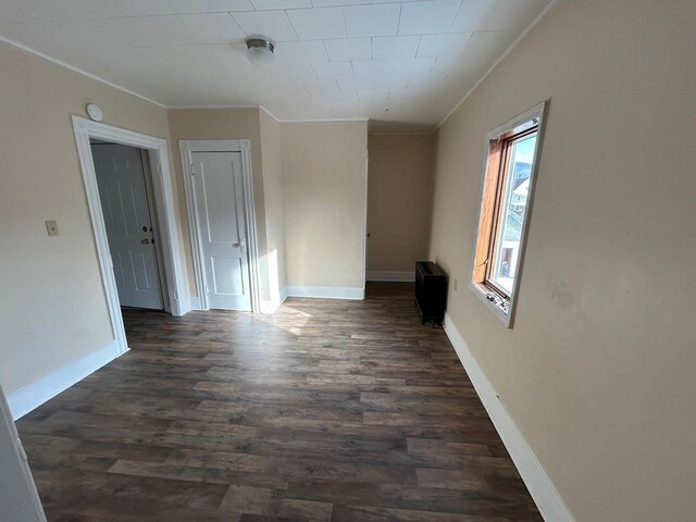 232 Birchwood Ave, Horseheads, NY 14903 - unfurnished room with crown molding, dark wood-style flooring, and baseboards