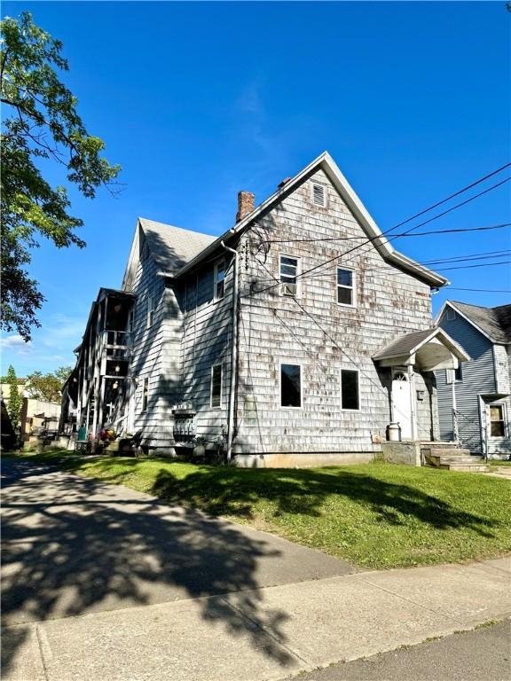 232 Birchwood Ave, Horseheads, NY 14903 - view of side of home featuring a chimney and a yard