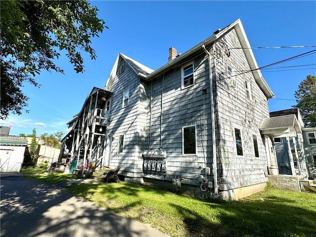 232 Birchwood Ave, Horseheads, NY 14903 - view of home's exterior with a chimney and a yard