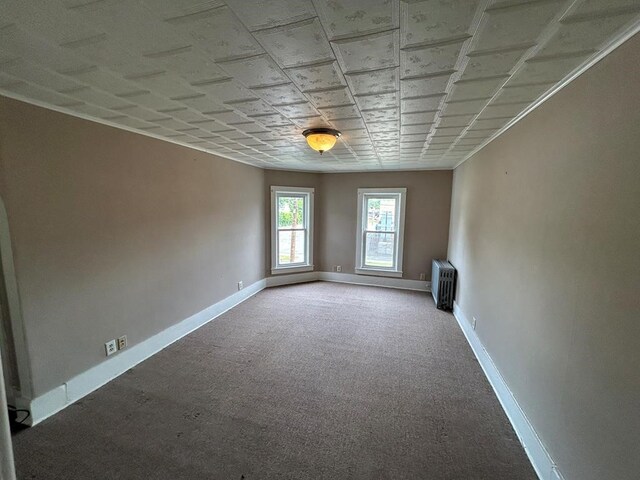237 Scottwood Ave, Horseheads, NY 14903 - carpeted spare room with radiator heating unit and baseboards