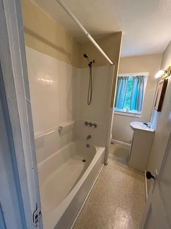 237 Scottwood Ave, Horseheads, NY 14903 - bathroom featuring vanity, washtub / shower combination, and baseboards