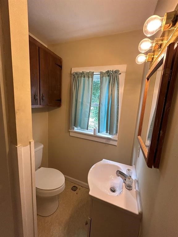 237 Scottwood Ave, Horseheads, NY 14903 - bathroom with vanity, toilet, and baseboards