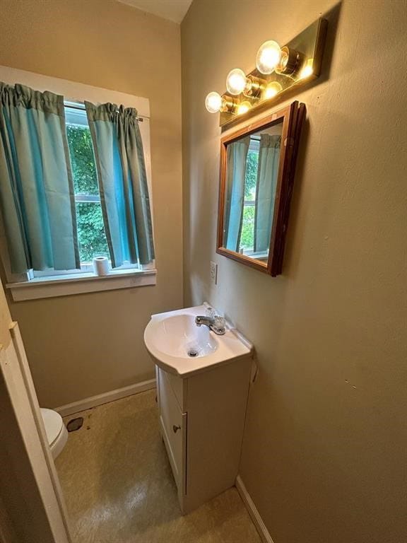 237 Scottwood Ave, Horseheads, NY 14903 - half bathroom featuring vanity, baseboards, and toilet