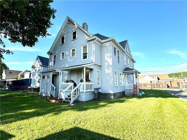 237 Scottwood Ave, Horseheads, NY 14903 - back of house with a chimney and a porch