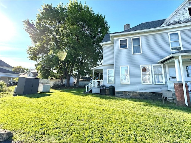 237 Scottwood Ave, Horseheads, NY 14903 - back of house featuring a chimney and a lawn