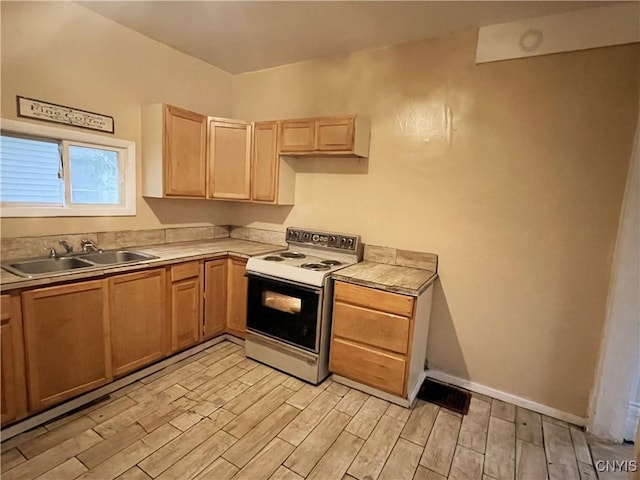 308 Rowland St, Syracuse, NY 13204 - kitchen with white range with electric cooktop, a sink, light brown cabinets, light wood-style flooring, and baseboards