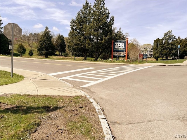 308 Rowland St, Syracuse, NY 13204 - view of asphalt street with traffic signs, curbs, and sidewalks