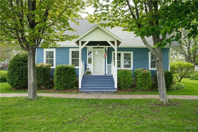 485 E Joseph St, Cape Vincent, NY 13618 - view of front of house featuring a front yard and roof with shingles
