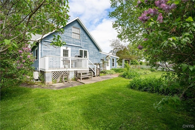 485 E Joseph St, Cape Vincent, NY 13618 - back of property with a deck and a lawn