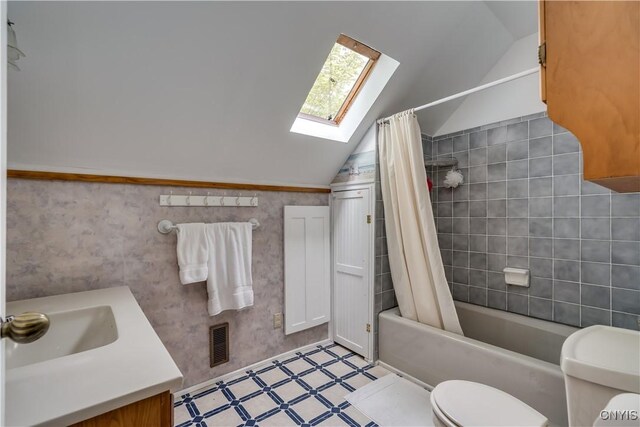 485 E Joseph St, Cape Vincent, NY 13618 - bathroom with a skylight, lofted ceiling, toilet, shower / tub combo, and vanity