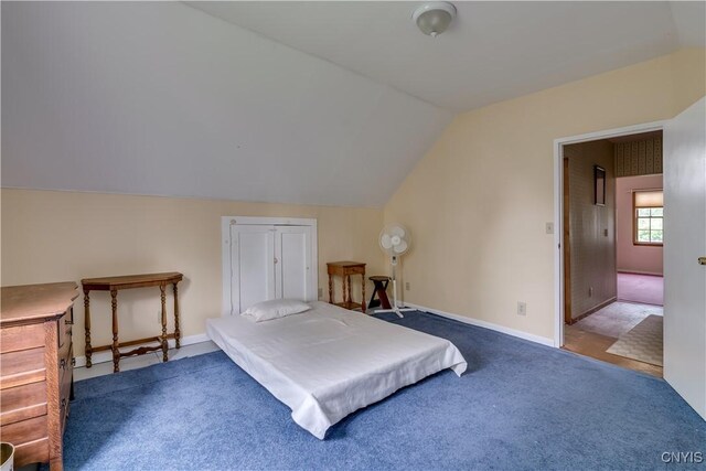 485 E Joseph St, Cape Vincent, NY 13618 - carpeted bedroom featuring vaulted ceiling and baseboards