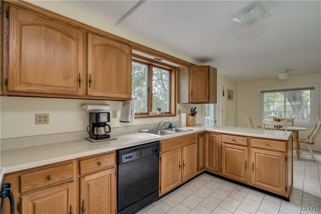 485 E Joseph St, Cape Vincent, NY 13618 - kitchen featuring dishwasher, a sink, light countertops, a peninsula, and light tile patterned floors