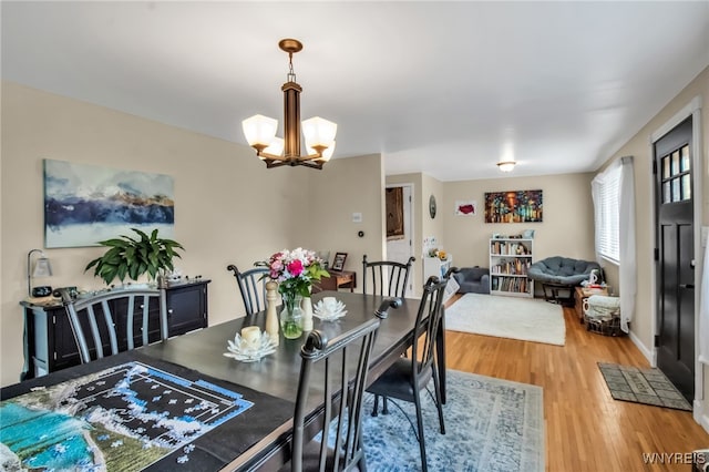 47 Acacia Dr, Amherst, NY 14228 - dining area featuring light wood finished floors and a chandelier