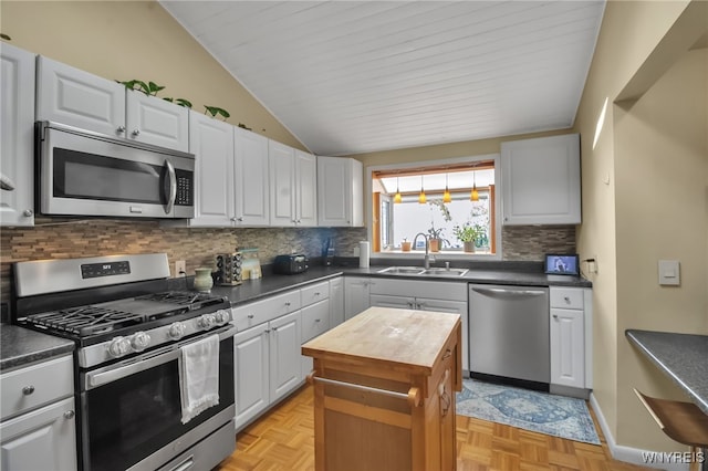 47 Acacia Dr, Amherst, NY 14228 - kitchen featuring appliances with stainless steel finishes, a sink, wood counters, backsplash, and vaulted ceiling